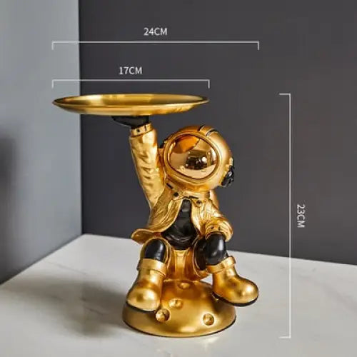 Creative sculpture of an astronaut with a tray - golden 1 -