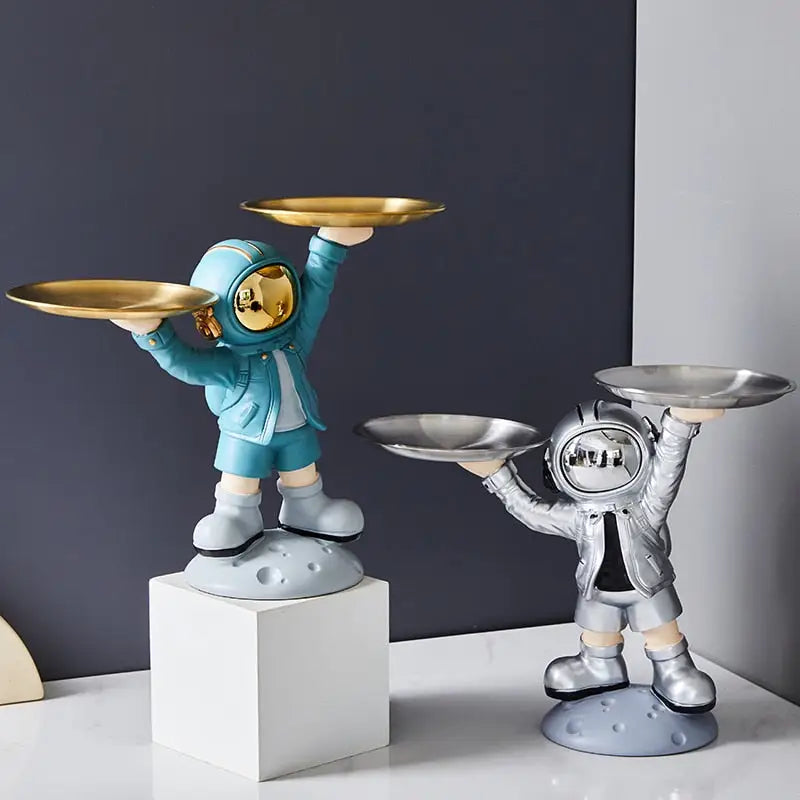 Creative sculpture of an astronaut with a tray - toys