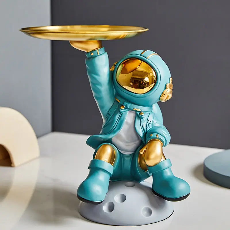 Creative sculpture of an astronaut with a tray - toys